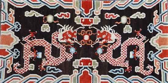 A Tibetan dragon khaden rug, early 20th century, 183 x 94cm